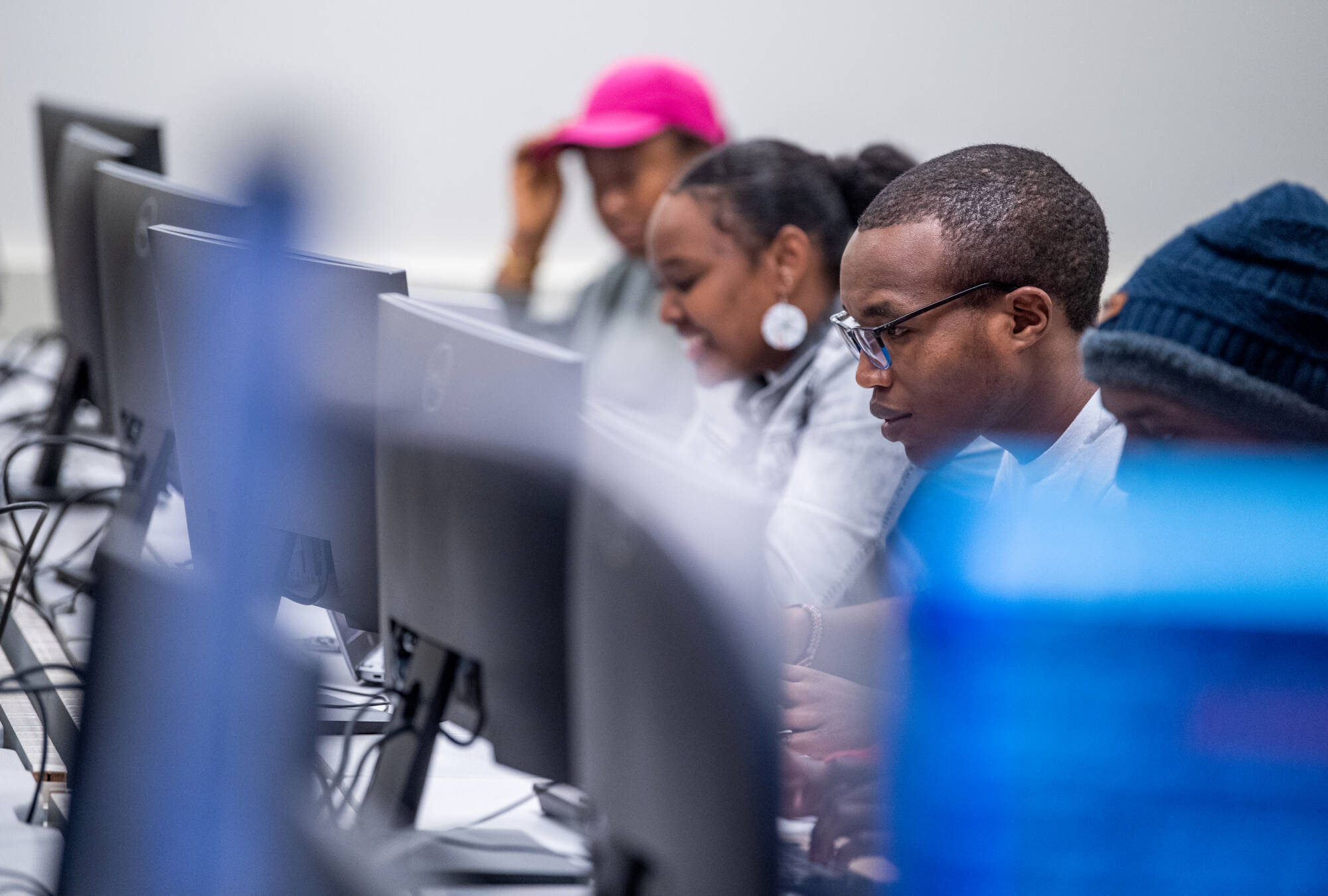 Students from Professor Samah Mansour's computing class work in the Cyber Threat Range, December 4, 2023.